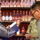 Petugas Satpol PP Surabaya saat melakukan pengawasan ke beberapa tempat yang menjual minuman beralkohol tanpa izin secara rutin. Foto Dokumentasi Diskominfo Surabaya